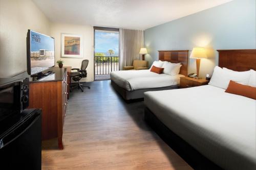 Ένα ή περισσότερα κρεβάτια σε δωμάτιο στο Hotel Tybee