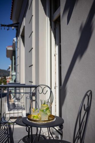a table with a vase on it on a balcony at Λιθεία-Lithia in Ioannina