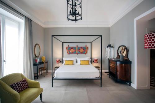 Katil atau katil-katil dalam bilik di Vossia Luxury Rooms & Sicilian Living