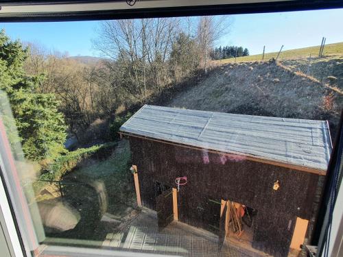 a view of a barn from a window at Fewo-hierundjetzt Lichtenhain bei Sebnitz am Malerweg in Lichtenhain