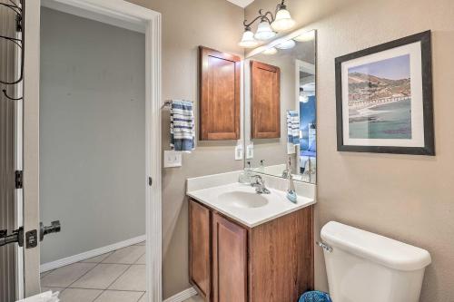 a bathroom with a sink and a toilet at Laguna Vista Home with Resort Perks Near Beach! in Laguna Vista