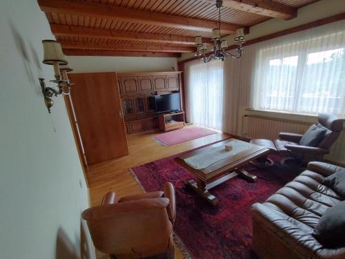 a living room with a couch and a coffee table at Haus Kink in Kleinstübing