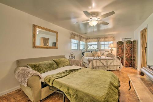 a living room with a couch and a ceiling fan at Bright Springfield Home Walk to Nature Center! in Springfield