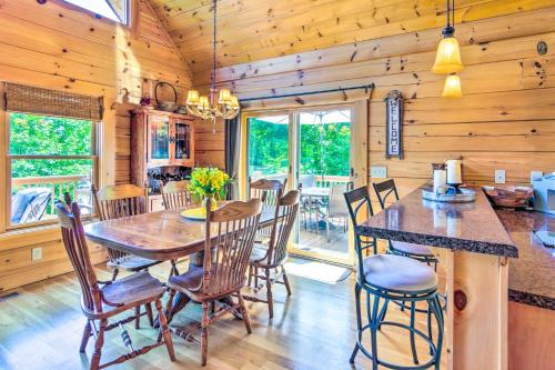 a dining room with a table and chairs at Tranquil Deck Blue Ridge Mountain Retreat! in Nebo