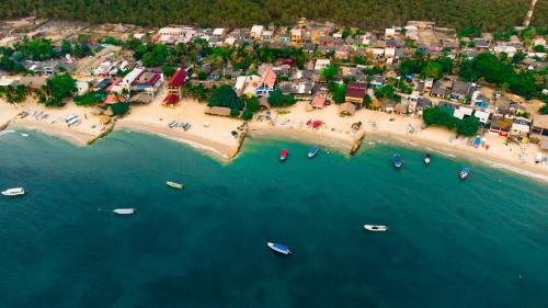 an aerial view of a beach with boats in the water at Mamallena Beachside Rincon del Mar in Rincón