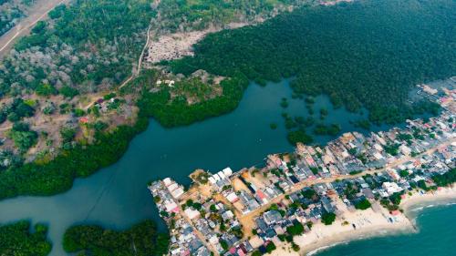 an aerial view of a resort next to a body of water at Mamallena Beachside Rincon del Mar in Rincón