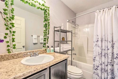 a bathroom with a sink and a toilet at 8 Mi to Downtown Little Rock Home with Fenced Yard in Little Rock