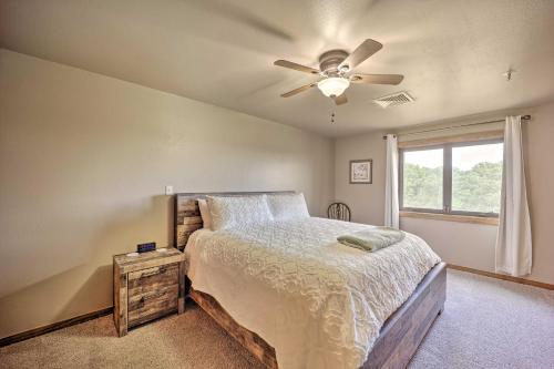 a bedroom with a bed and a ceiling fan at Golf Course and Lake Views Cozy Afton Condo! in Afton