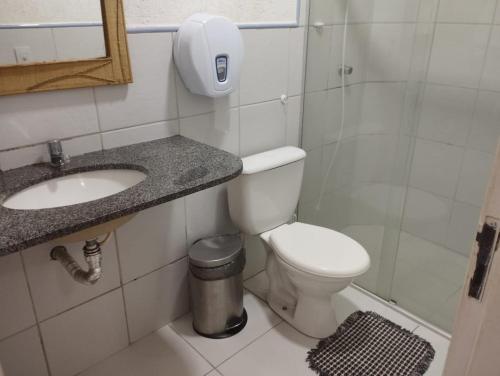 a bathroom with a toilet and a sink at Porto dos Lençóis, Apartamento 05 in Barreirinhas