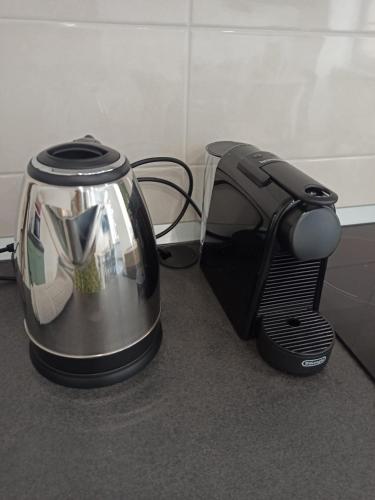 a tea kettle is sitting next to a toaster at Dream Baveno in Baveno