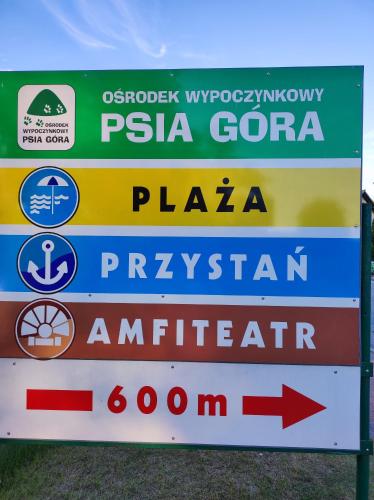 a sign for a pizzaorecca plaza and a istg istg istg at Sielsko Anielsko -Domki Swornegacie in Swornegacie 