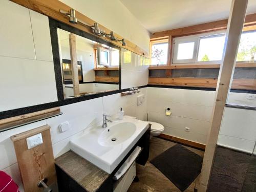 a bathroom with a sink and a toilet at Chalet Magda-Lena in Heiligenblut
