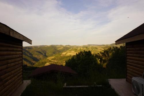 a view of a valley from the balcony of a house at Gödence Hotel Restoran Bungalow in Gödence