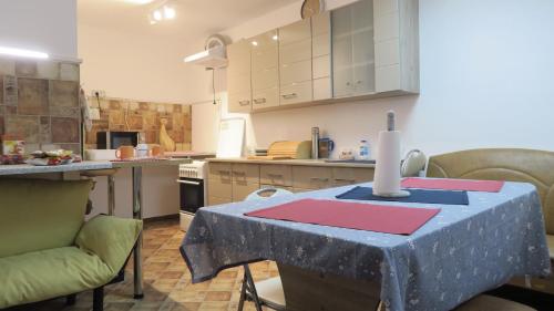 a kitchen with a table with a candle on it at Aeroport - Relax Casa Victoria in Otopeni