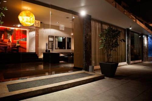 a lobby with a potted plant in a building at Hotel Tivoli Beira in Beira
