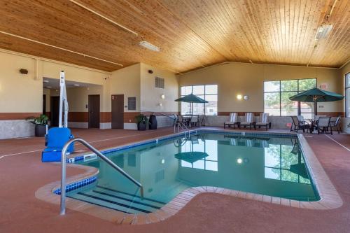 a large indoor pool with a wooden ceiling at Best Western Plus Chelsea Hotel in Monticello