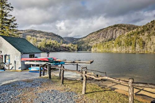 a lake with a dock and a house and mountains at Quiet Blue Ridge Haven Less Than 4 Mi to Sapphire Resort! in Sapphire