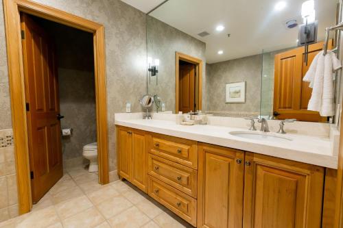 a bathroom with a sink and a toilet at Luxury King Room with Mountain View Hotel Room in Park City