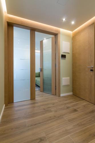 an empty room with a door and a hallway at Mayisa Apartments in Sarajevo