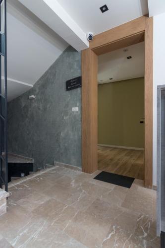 an empty room with a wall and a pillar at Mayisa Apartments in Sarajevo