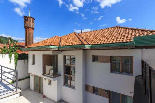 a rendering of a house with a water tower at Mayisa Apartments in Sarajevo