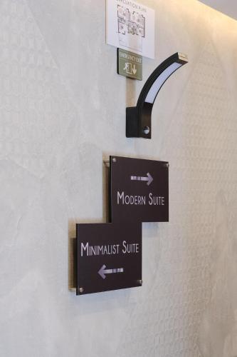 a sign for a mimitzhurst suite on a wall at Mayisa Apartments in Sarajevo