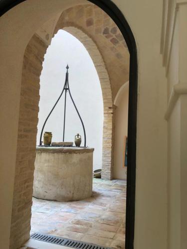 an archway in a building with a fountain in it at Dimora Anelli in Vasto