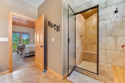 a large bathroom with a shower and a walk in shower at Ridgeview Retreat in Sturgis