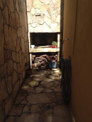 a stone hallway with a stone fireplace in a building at Seaside holiday house Prigradica, Korcula - 11484 in Blato