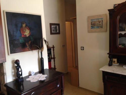 a room with a dresser and a painting on the wall at Seaside holiday house Prigradica, Korcula - 11484 in Blato