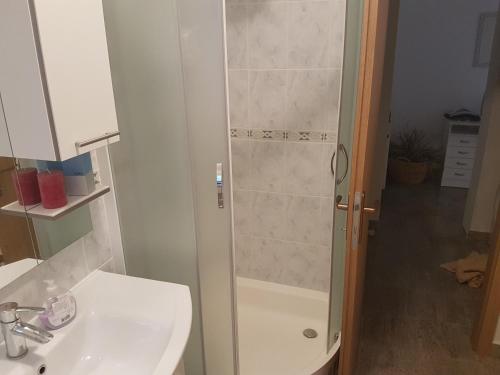 a bathroom with a shower and a sink at Apartments with a parking space Omis - 13785 in Omiš