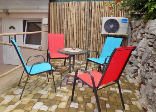 a group of chairs and a table on a patio at Apartments with a parking space Matulji, Opatija - 13890 in Matulji