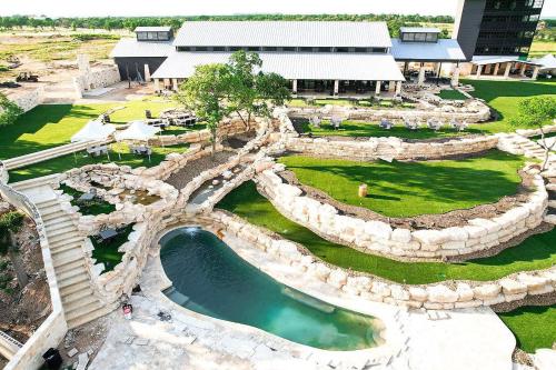 an aerial view of a water park in front of a building at Farmhouse Style Tiny Home with Patio - 4 mi to Town in Fredericksburg