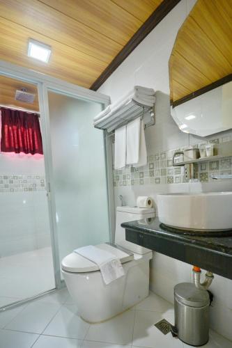 a bathroom with a toilet and a sink at Diamond Water Edge Resort in Boracay