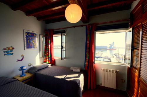 Tempat tidur dalam kamar di A Pousada do Mar Ferrol