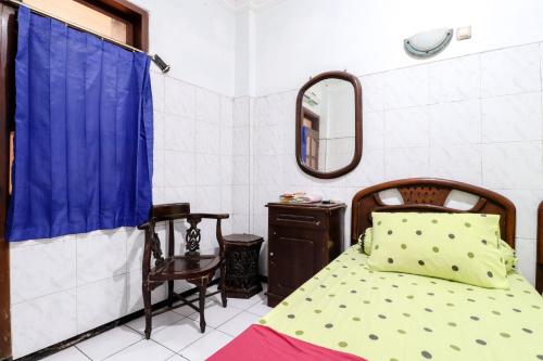 Postel nebo postele na pokoji v ubytování Hotel Gajah Mada