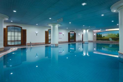 a large swimming pool in a building at Crowne Plaza Chengdu City Center, an IHG Hotel in Chengdu