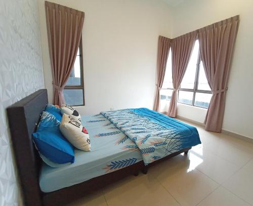 a bed in a room with two windows at ComfyHome at Palas Horizon Residence with sunrise view in Brinchang