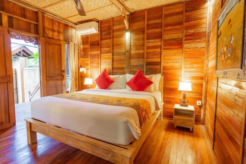 Postel nebo postele na pokoji v ubytování Nauna Villa Ubud