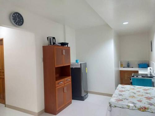 a room with a kitchen with a counter and a refrigerator at Susana Goles Holiday House in Saavedra