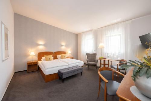 Postel nebo postele na pokoji v ubytování Hotel Moritz an der Elbe