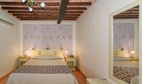 Ένα ή περισσότερα κρεβάτια σε δωμάτιο στο Hotel Villa Cheli