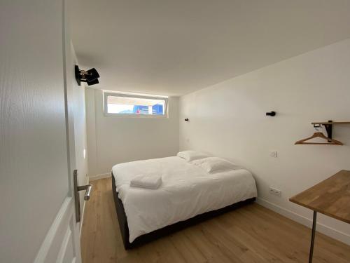 Posteľ alebo postele v izbe v ubytovaní Le BeachHaus - Appartement avec Jardin a 100m de la Mer