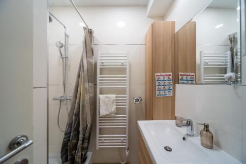 a bathroom with a sink and a shower at Cosy&Private,30sec walk to MainSquare, Heart of Zagreb in Zagreb