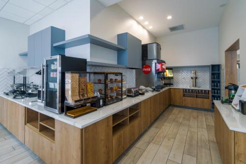 a kitchen with blue cabinets and a counter top at Staybridge Suites - Louisville - Expo Center by IHG in Louisville