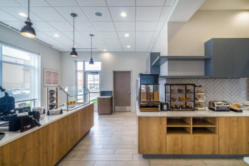a lobby of a store with a counter with food at Staybridge Suites - Louisville - Expo Center by IHG in Louisville