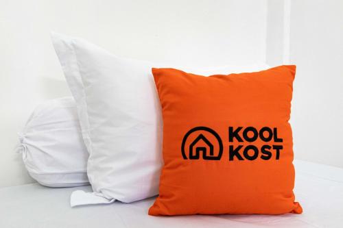 an orange pillow with the kodak logo on it at KoolKost Syariah @ Wisma Arafah Tasikmalaya (Minimum Stays 30 Nights) in Tasikmalaya