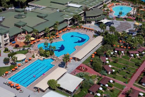an overhead view of a pool at a resort at MEDWORLD Health & Rehabilitation Center Pine Beach Belek in Belek