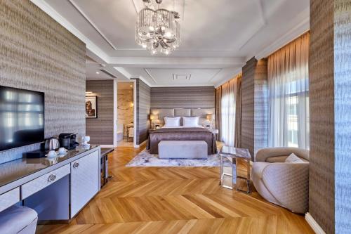 a bedroom with a bed and a tv and a couch at Hotel De Reve Galata-Special Class in Istanbul