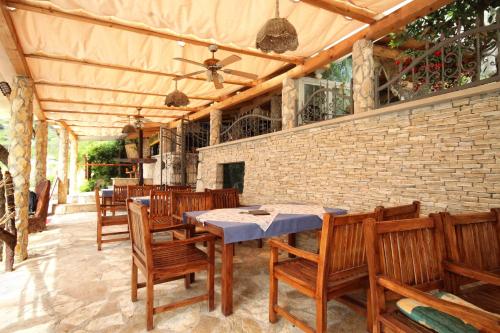 a dining room with a table and wooden chairs at Apartments by the sea Hvar - 10430 in Hvar